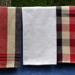 Dish towels hanging in a row